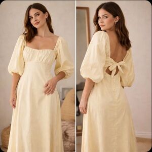 Free people yellow dress with bow on the back and puffy arms. Size M